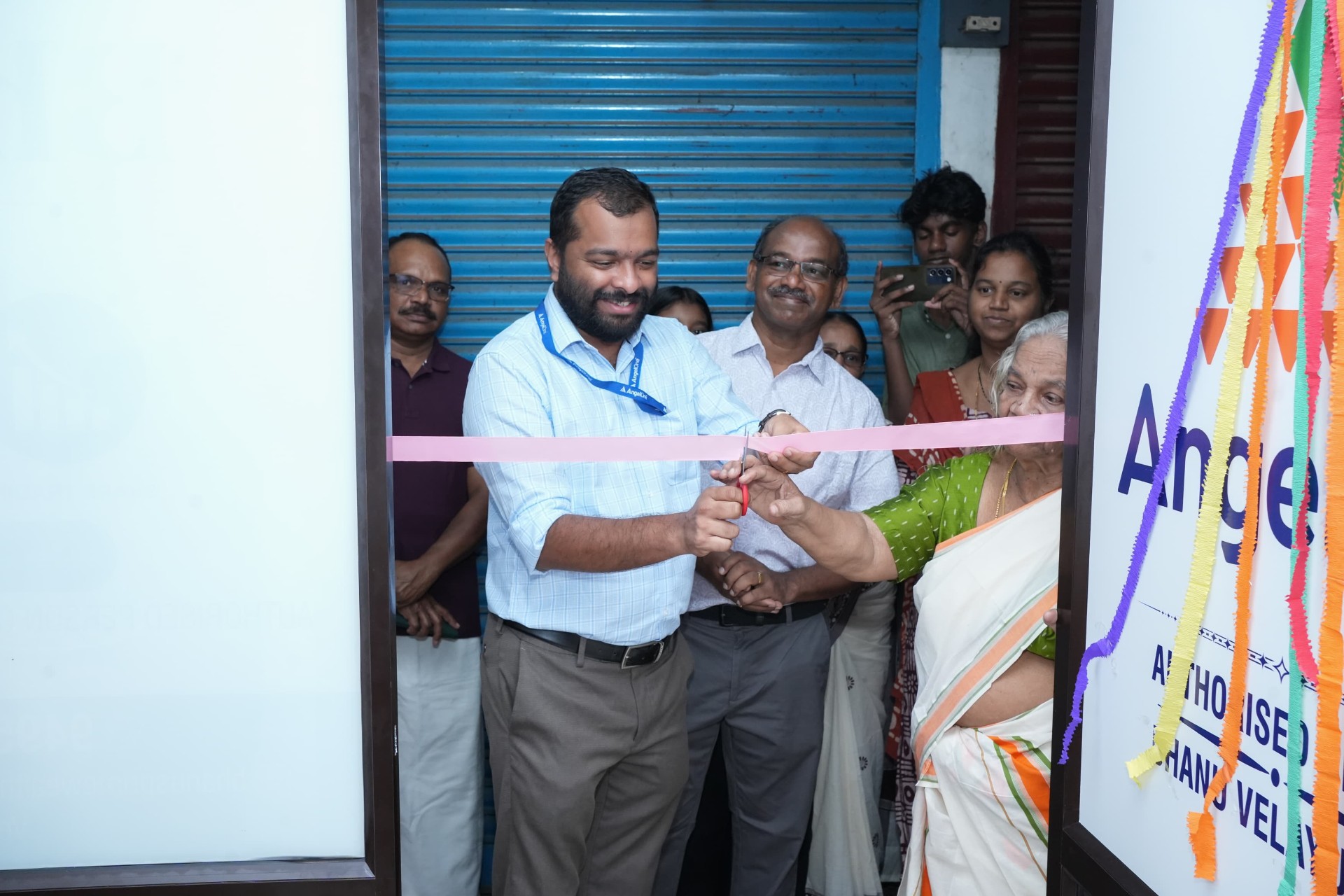 Cutting the ribbon to officially open the Nemmara office